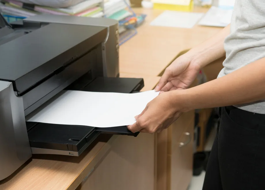 A document being printed on an office laser printer
